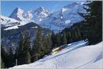 Eiger M�nch und Jungfrau - so der Name der drei Berge im Bild Hintergrund. Die BLM nahm die herrlichen Berge zum Anlass ihre drei neune Be 4/6 danach zu benennen. Einer der erw�hnten Triebwagen ist am unteren Bildrand zu erkennen. W�hrend man auf der Fahrt mit der BLM eine herrliche Aussicht auf Eiger M�nch und Jungfrau hat, ist es nicht einfach eine einigermassen gute Stelle zum Fotografieren von Zug UND Gipfel zu finden. 

18. Feb. 2025